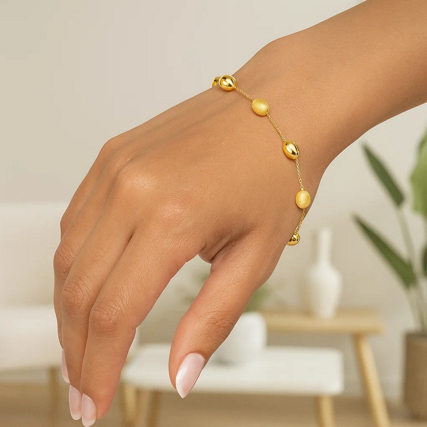 14k Yellow Gold Bracelet with Textured and Polished Pebble Stations (6.35 mm)